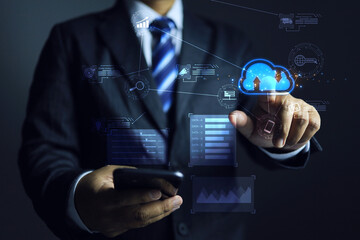 Businessmen using smartphones to receive information and conduct financial transactions or communicate over the internet through a modern cloud computing system.