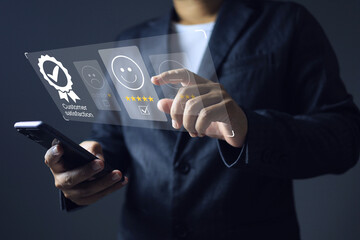 Businessman evaluate service online interface platform in customer satisfaction via smartphone in very good point 5 star to very good and satisfy in service and product provided.