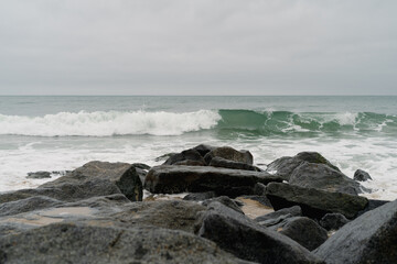 Waves hitting rocks in California