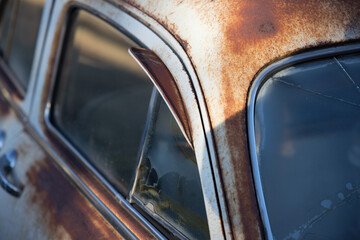 Old, rusty car with windows