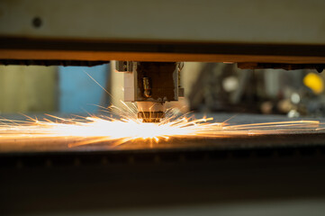 CNC machine. Laser cutting of metal. Sparks.