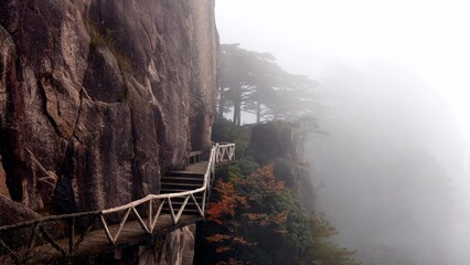 Fog shrouded staircase in Huangshan Mountains