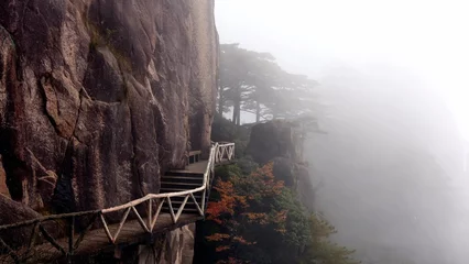 Wall murals Huangshan Fog shrouded staircase in Huangshan Mountains