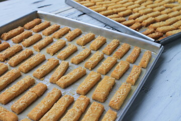 Rows of Indonesian cakes called kastangel on a table ready to serve