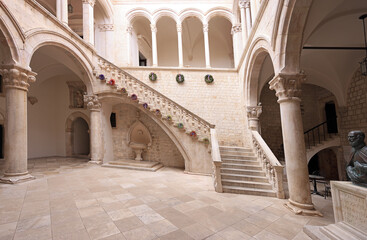 Fototapeta premium Atrium and staircase inside Rector's Palace in old town of Dubrovnik. The palace was used to serve as the seat of the Rector of the Republic of Ragusa between the 14th century and 1808.