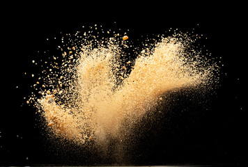 Obraz premium Big size Sand flying explosion, Golden grain wave explode. Abstract cloud fly. Yellow colored sand splash throwing in Air. Black background Isolated selective focus blur