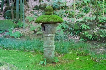 Small stone lantern with moss at Hokokuji Temple
