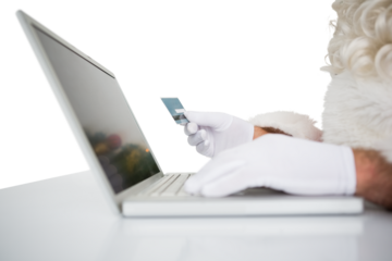 Digital png photo of hands of santa claus using laptop and credit card on transparent background