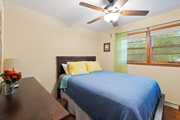 Interior of stylish room with big bed and sofa and window, Ceiling lights