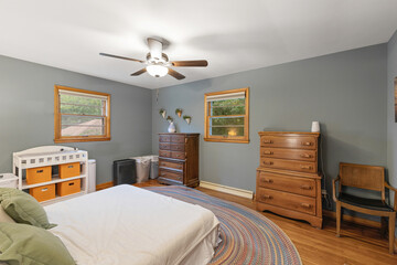 Interior of stylish room with big bed and sofa and window, Ceiling lights