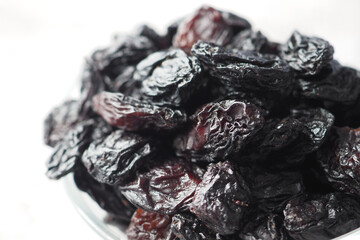 black raisin on white background, close up,