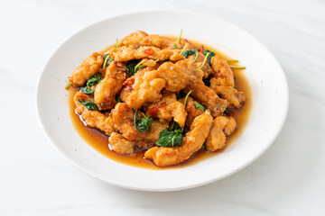 stir-fried fried fish with basil and chili in thai style