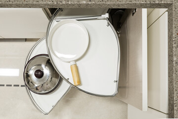 A corner unit with pullout shelves for cookware.