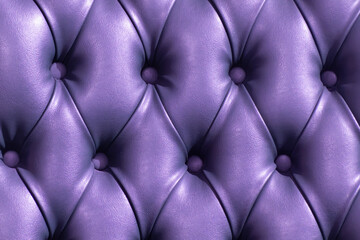 image of a violet leather upholstery with symmetry of the buttons and lines