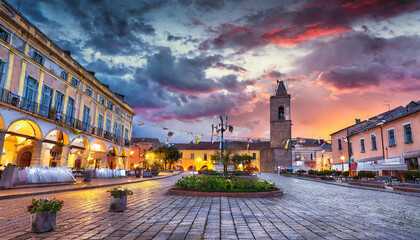 The center of the town, square at dramatic sunset