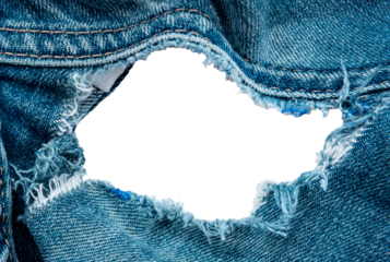 Hole in denim on a white background. Ripped jeans