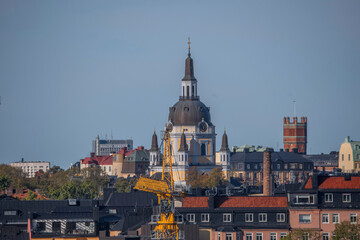 The church Katarina kyrka, brick water tower, and apartments in the district Södermalm, a sunny autumn day in Stockholm