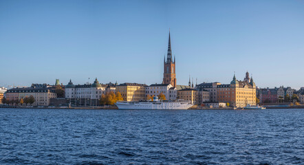 Fototapeta na wymiar The islands Riddarholmen and the old town Gamla Stan, hostel ship and churches, a sunny colorful autumn day in Stockholm