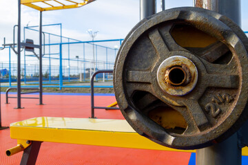 a public weight bar from about two and a half kg, a little worn and rusty