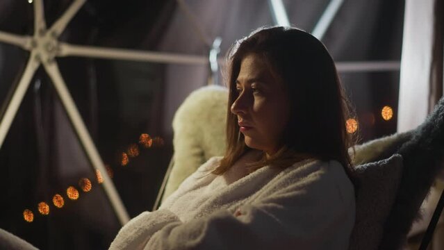 Woman has trampled appearance and sad expression of face reflecting weight of loneliness at moment. Bad days of spending vacation alone and depression slow motion