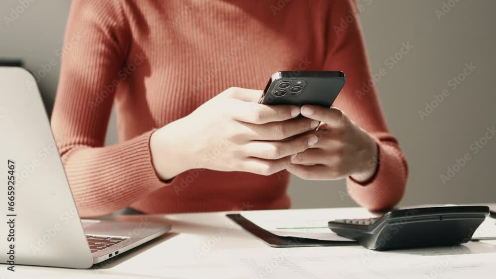 Poster a female employee is typing a message using a smartphone app to communicate with customers who place