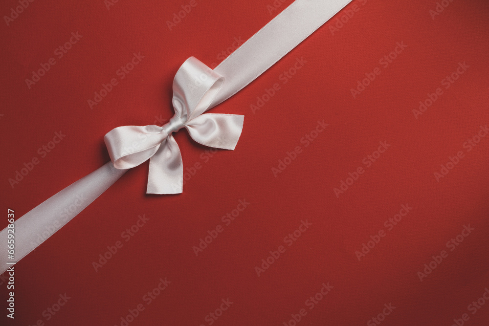 Wall mural White bow on red