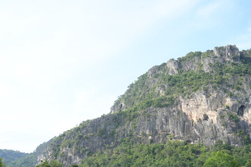 Fototapeta na wymiar Limestone mountains in Thailand There are many bats living there.