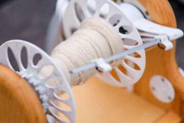 The modern spinning machine is equipped with industrial tools for efficient textile production.
