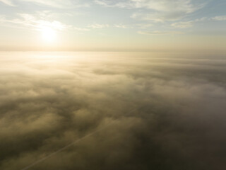 Riga, Latvia - AUGUST 20 2023.  the sun is shining over the clouds in the sky above.