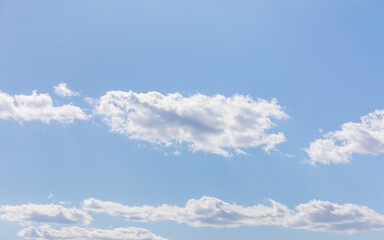 White bird clouds under the blue sky. sunny weather