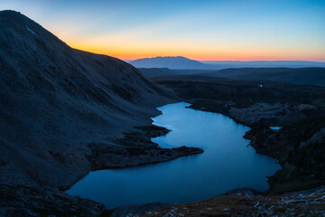 Twilight mountain lake with sunset afterglow