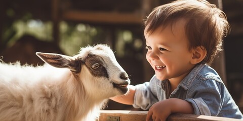 A thrilled toddler at a petting zoo, gently patting a baby goat, with both displaying curiosity and joy in their eyes, copy space - obrazy, fototapety, plakaty