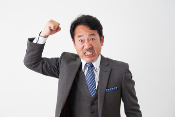 怒る中年のビジネスマン　白背景