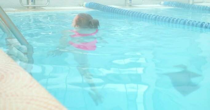 woman who swims badly nearly drowned, sink, girl gasping for air above water Slow motion. Bad Swim Practice. girl is bad at diving swimming