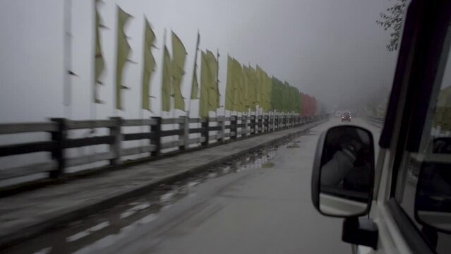 Car on a cloudy bridge in sikkim