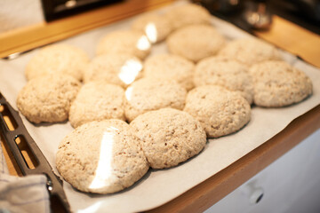 Closeup, tray and bread in an oven from a bakery for diet, nutrition and eating pastry food. Zoom, health and carbs, pita or loaves of rolls on a shelf for baking, cooking or lunch at a restaurant