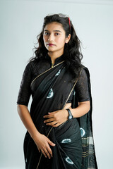 Portrait of a happy woman of Indian origin wearing saree