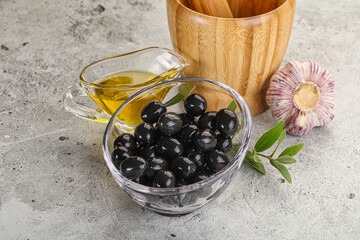 Black olives with oil and branch