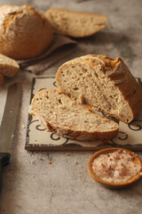 A loaf of rye bread in low key