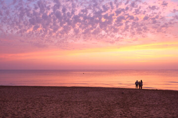 Sunrise with pink colors on the seashore