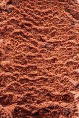 Structure of frozen chocolate ice cream close up. Ice cream background.