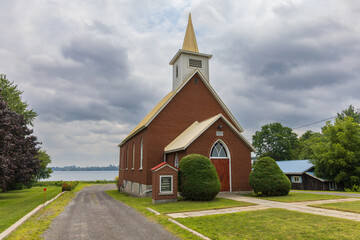 Fototapeta na wymiar Small church along the Saint Lawrence river in Johnstown, Canada