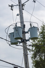 Multiple mono phase transformers used on a 3-phase network attached to a wooden pole