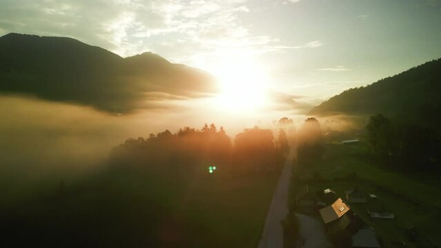 Drone footage of the sun rising over Kranjska Gora town, in the far northwestern corner of Slovenia
