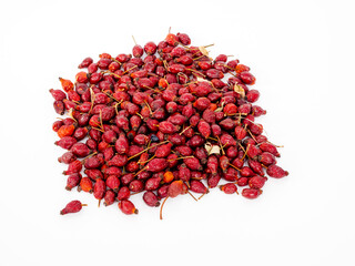 Dried rose hips on a white background. Rosehip close-up.