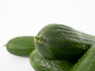 Organic cucumbers on a white background. Cucumbers close-up.