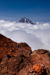 Kamchatka volcanic landscape: view to top of cone of Koryaksky Volcano from scenery active crater...