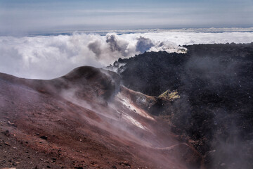 Kamchatka volcanic landscape: view to top of cone of Koryaksky Volcano from scenery active crater of Avacha Volcano on sunny day and blue sky. Russian Far East