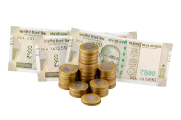 500 rupees note with coins pile isolated on white background with clipping path
