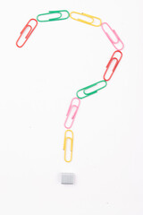 Top view of question mark created by paperclip